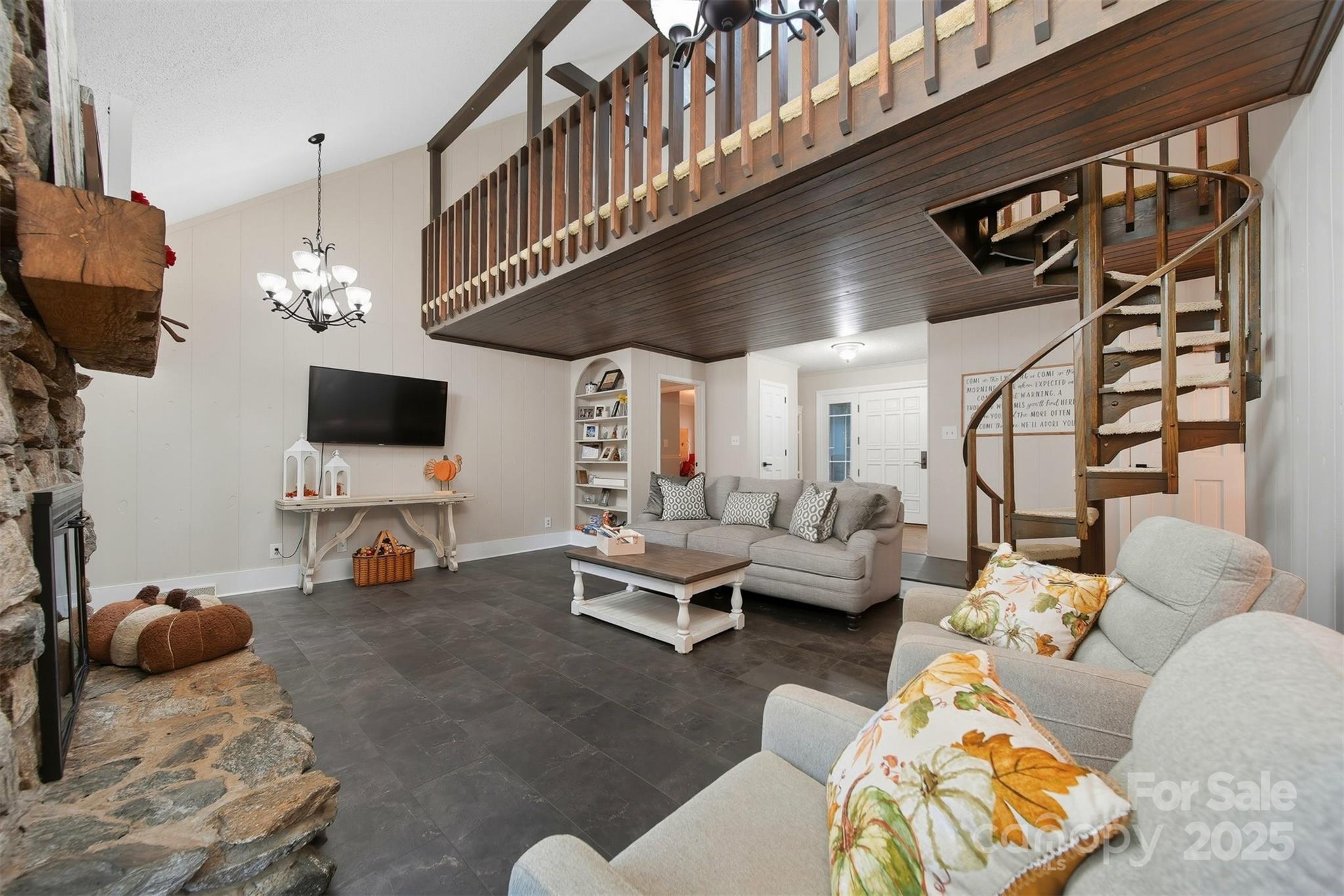 507 6th Avenue Northeast Conover, NC 28613 - Photo 5 of 48 a living room with furniture a flat screen tv and a floor to ceiling window