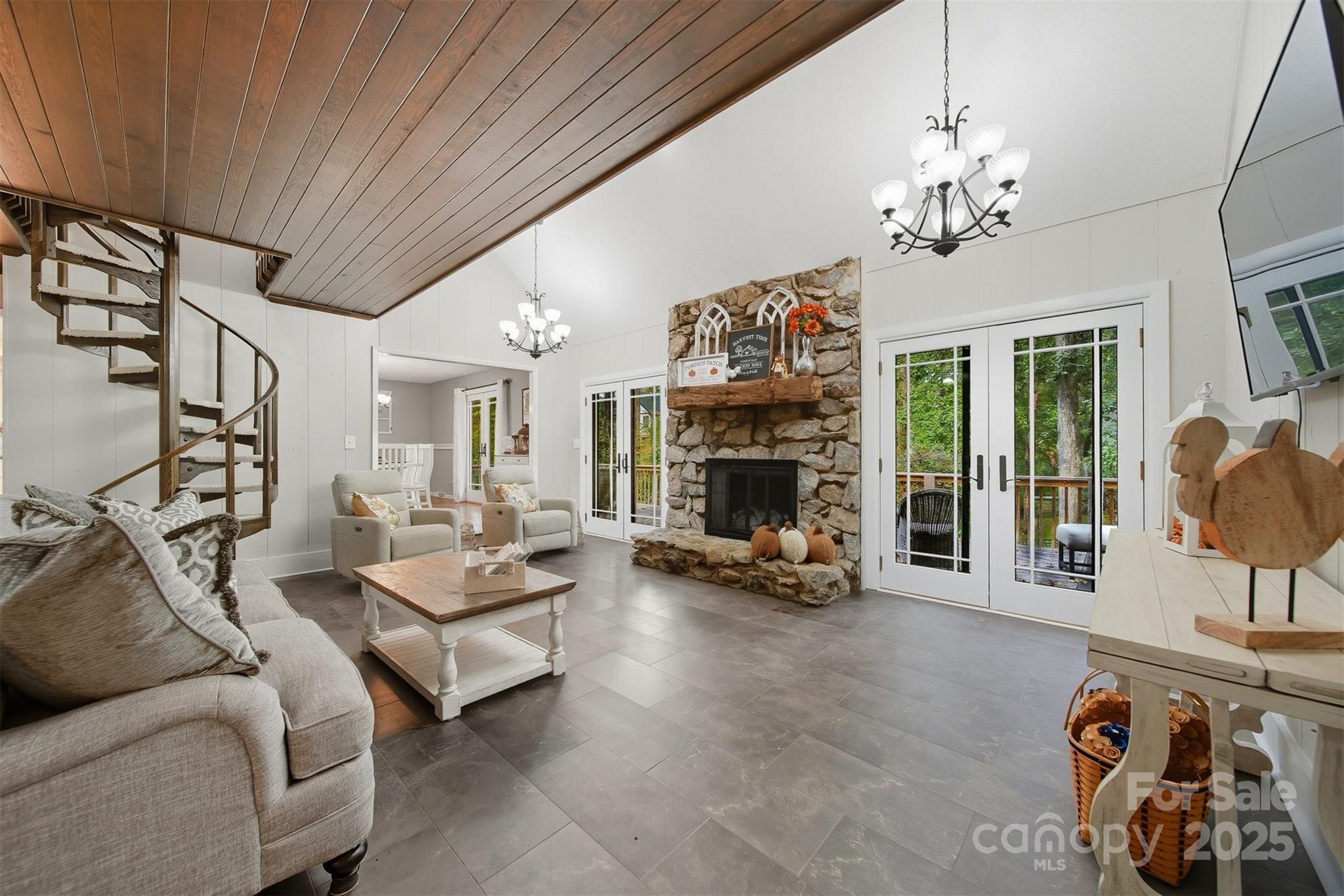 507 6th Avenue Northeast Conover, NC 28613 - Photo 6 of 48 a living room with furniture a chandelier and a fireplace