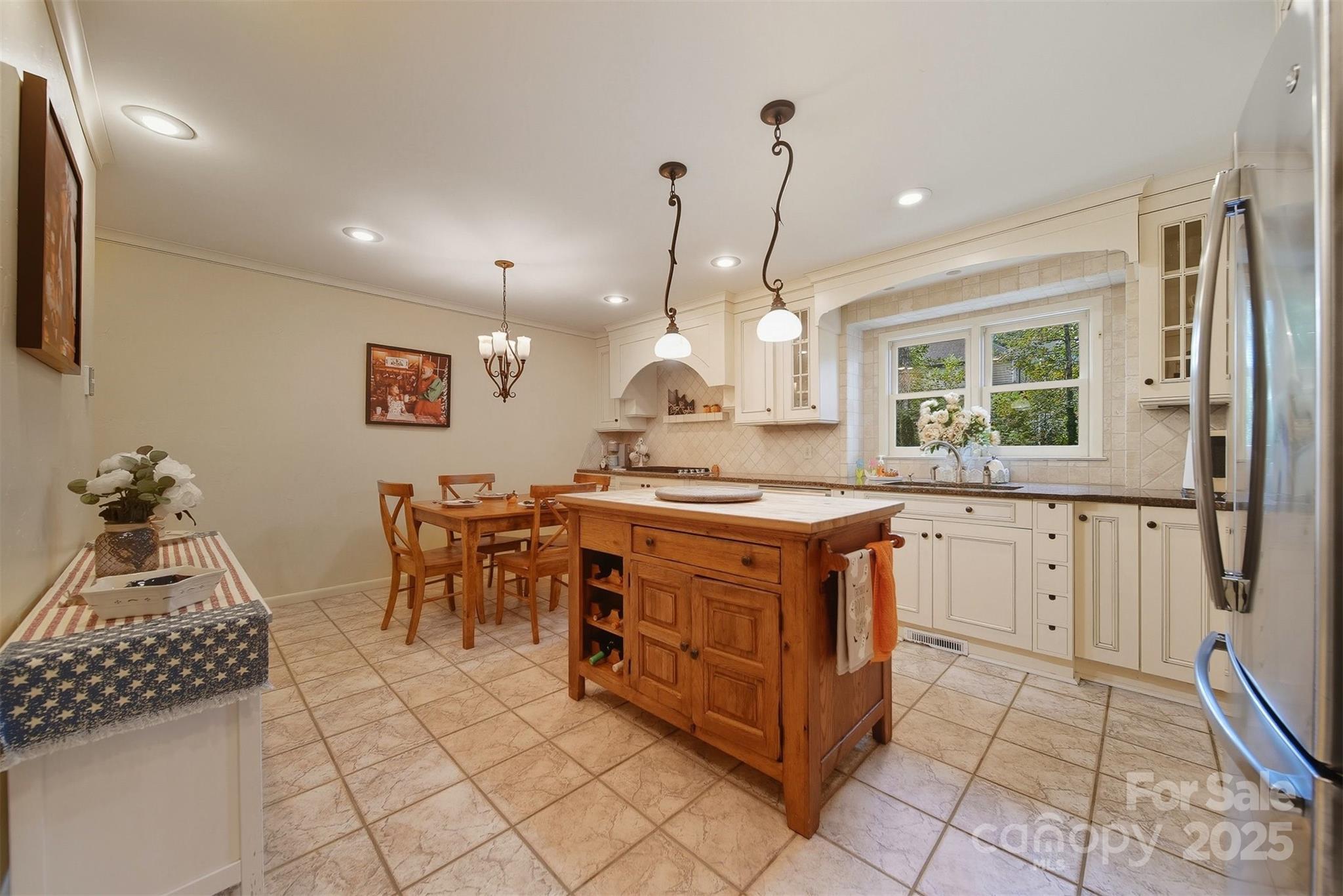 507 6th Avenue Northeast Conover, NC 28613 - Photo 10 of 48 a kitchen with stainless steel appliances granite countertop a stove a sink and a refrigerator