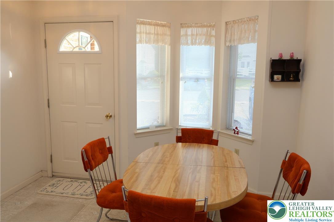 1282 Old Gate Road Northampton, PA 18067 - Photo 5 of 18 A charming breakfast nook, perfect for morning meals, offers ample natural light through multiple windows.