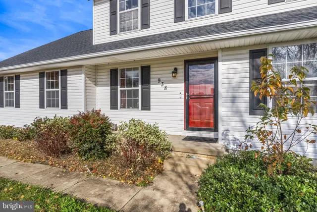 front view of a brick house with a large windows
