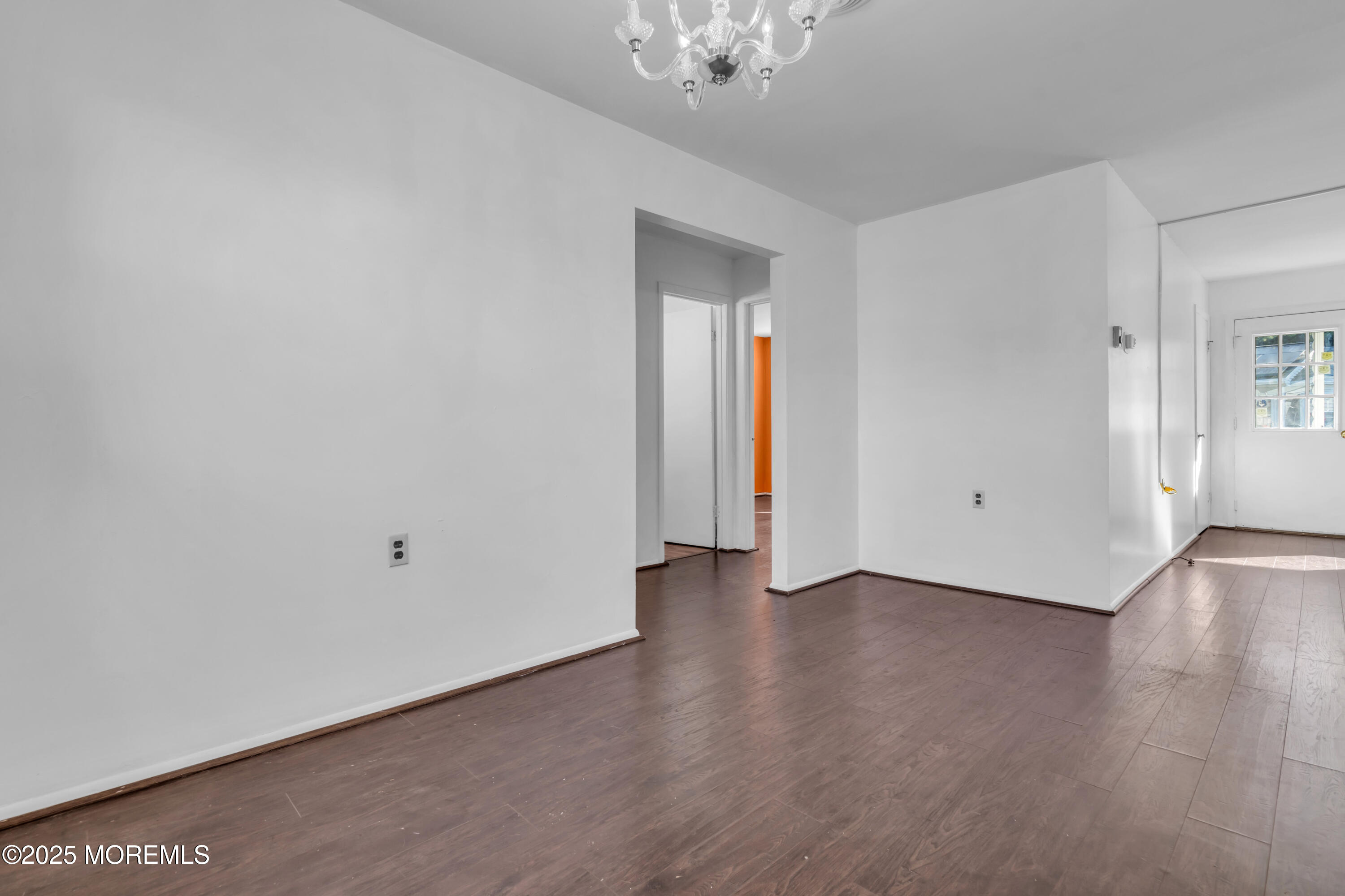 11 Hartford Road, Unit 70 Whiting, NJ 08759 - Photo 14 of 32 a view of an empty room with wooden floor and a window