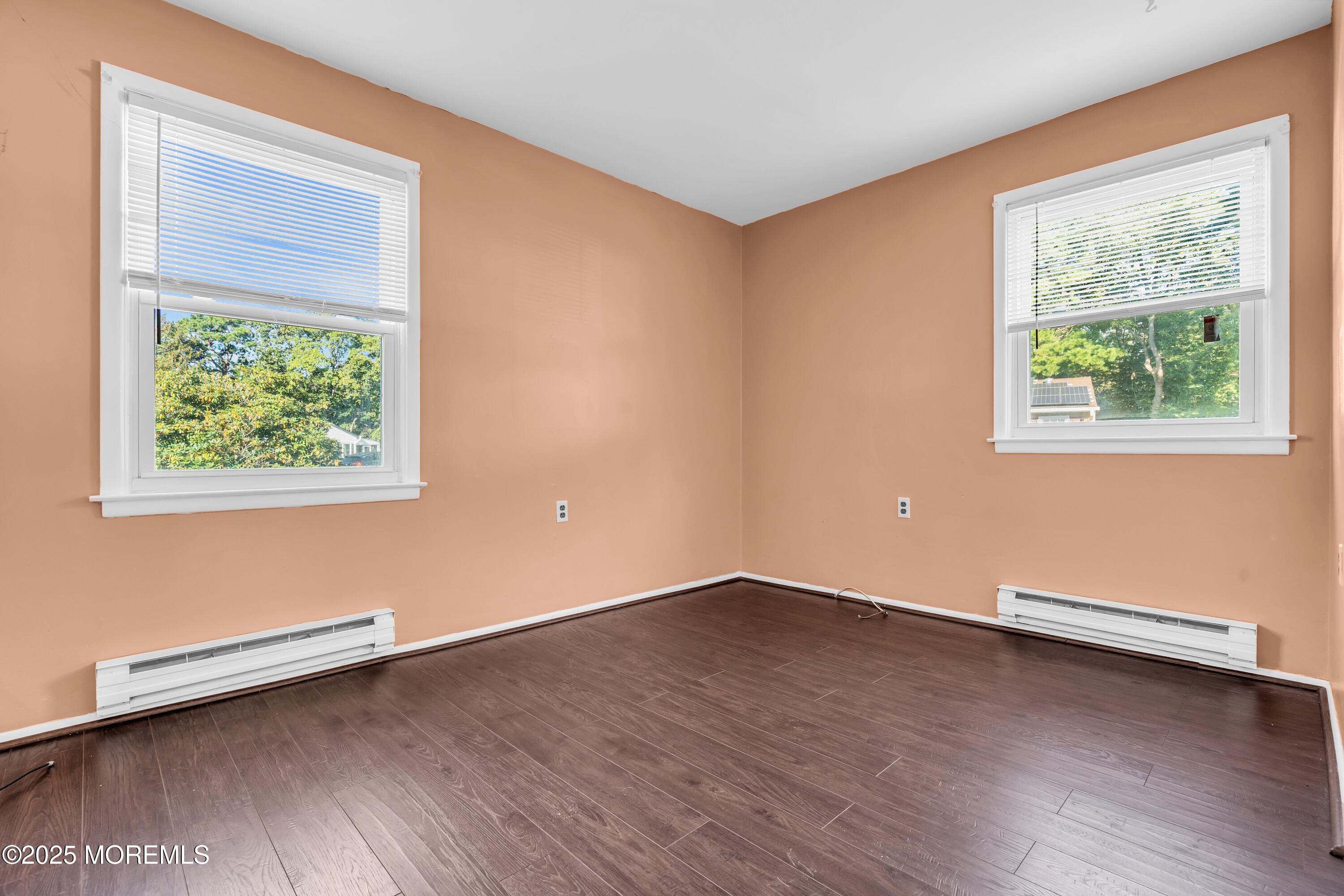 11 Hartford Road, Unit 70 Whiting, NJ 08759 - Photo 22 of 32 an empty room with wooden floor and windows