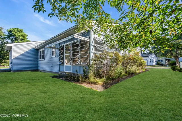 a view of backyard with green space