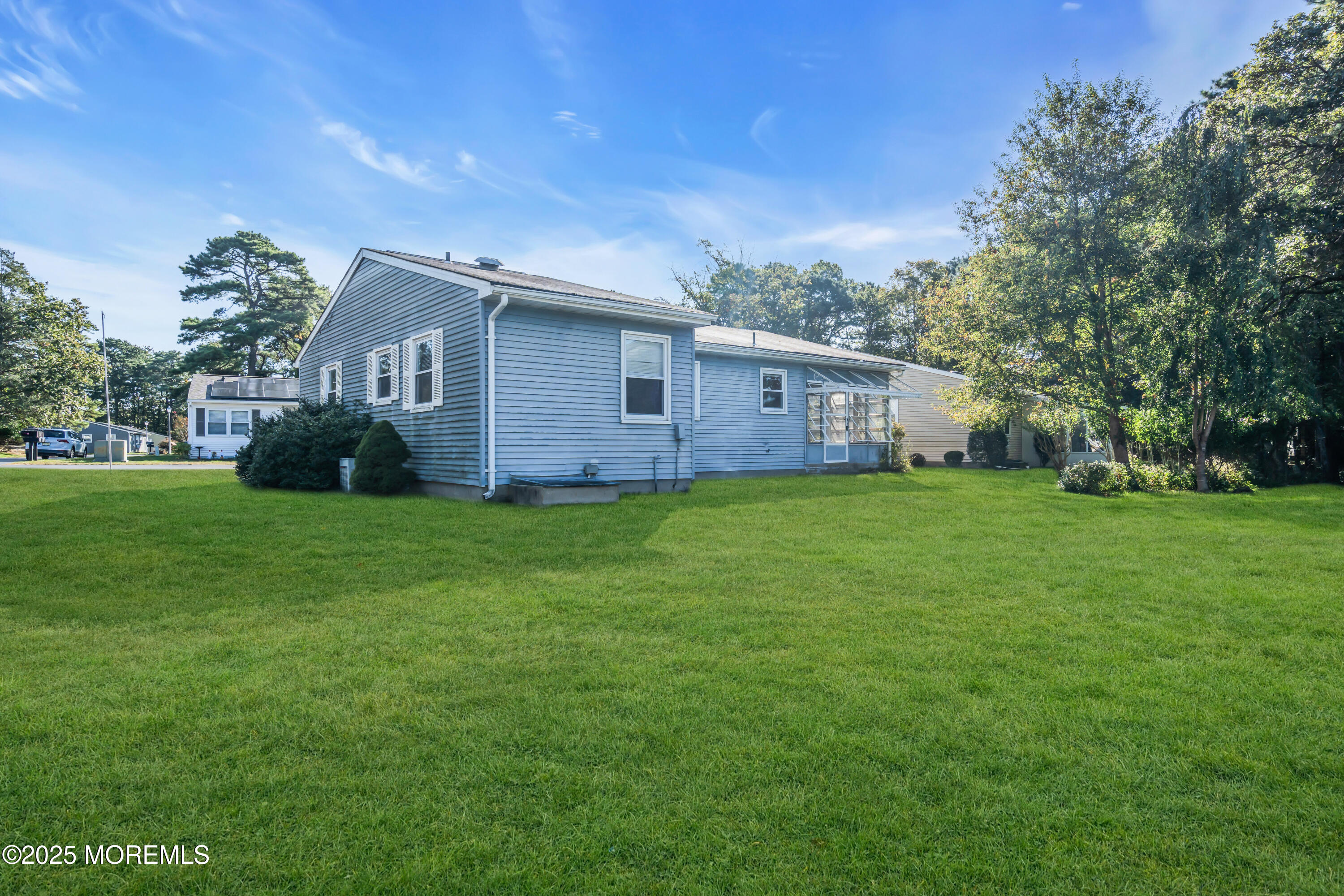 11 Hartford Road, Unit 70 Whiting, NJ 08759 - Photo 32 of 32 a view of a house with yard and a garden