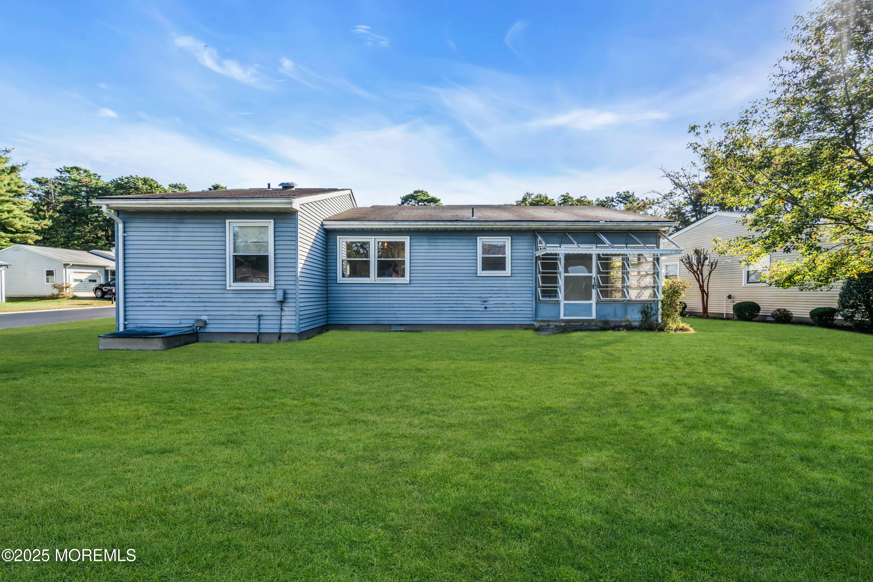 11 Hartford Road, Unit 70 Whiting, NJ 08759 - Photo 5 of 32 a brick house with a yard