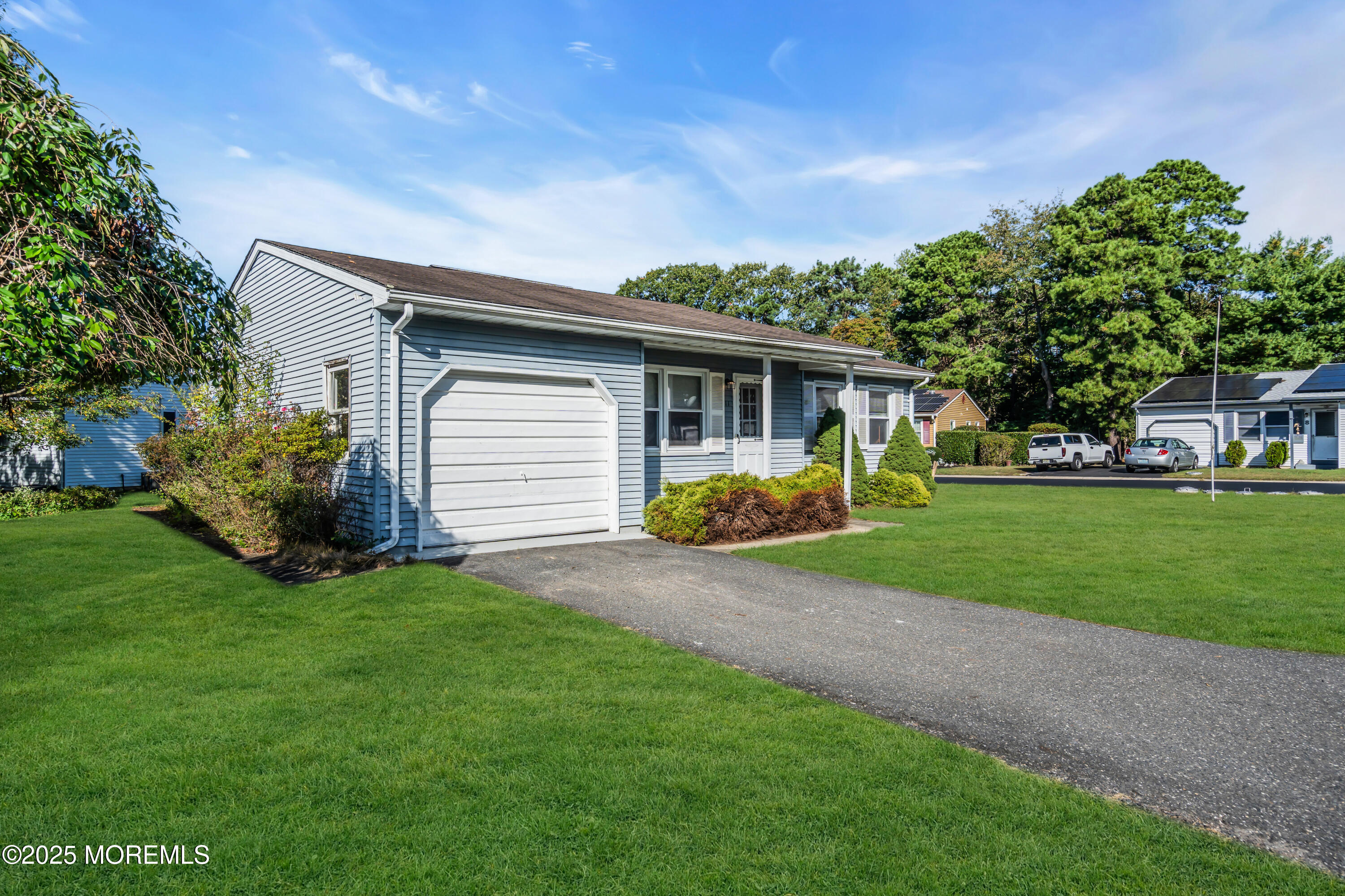 11 Hartford Road, Unit 70 Whiting, NJ 08759 - Photo 7 of 32 a front view of house with yard and green space