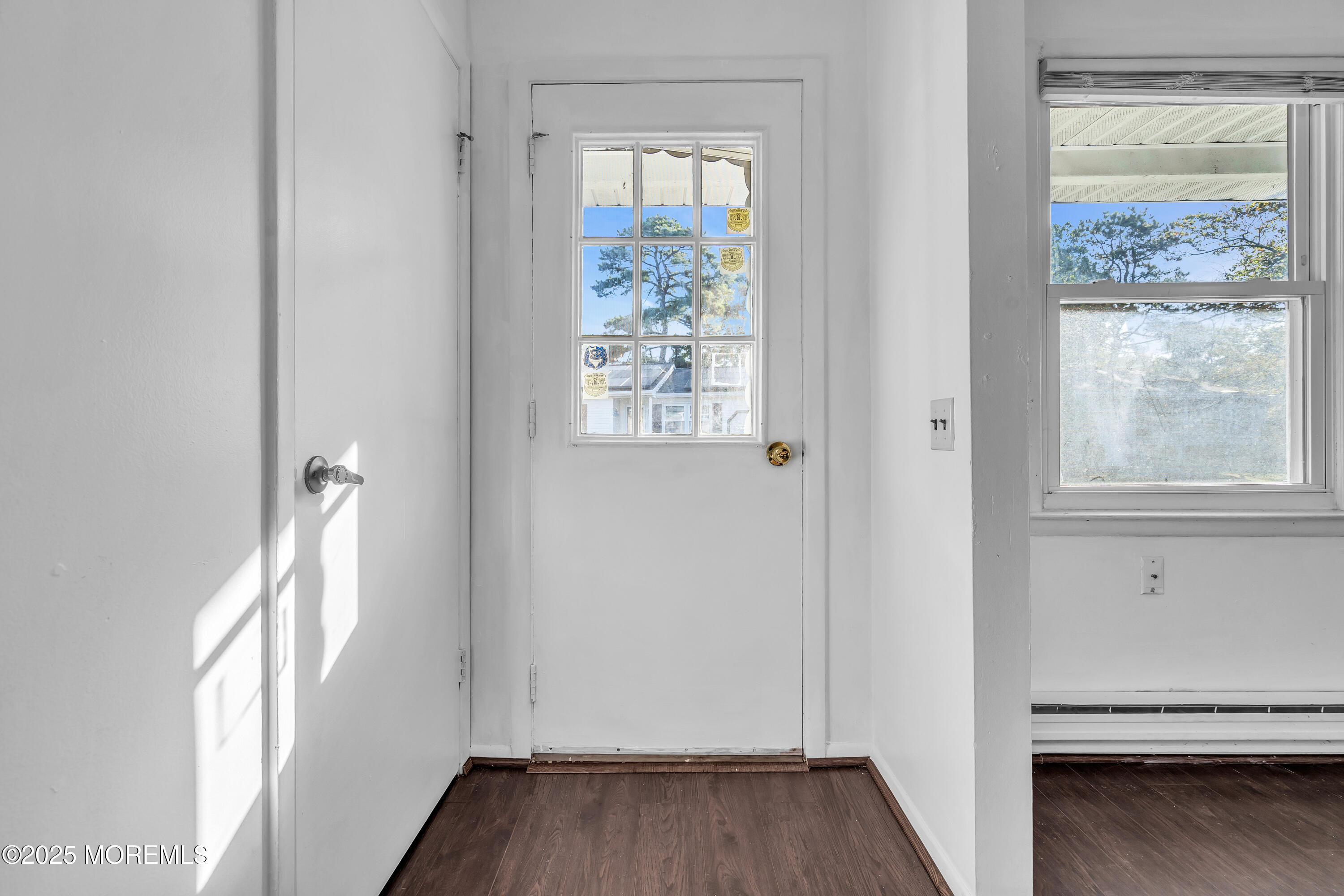 11 Hartford Road, Unit 70 Whiting, NJ 08759 - Photo 10 of 32 a view of hallway with window and wooden floor