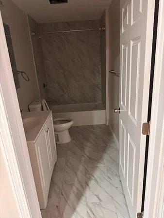 a bathroom with a sink and toilet