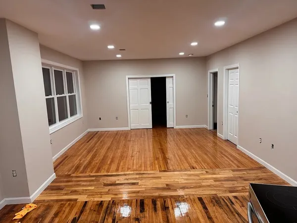 a room with a bed and cabinets