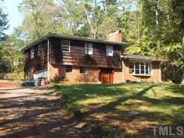 107 Longview Drive Raleigh, NC 27610 - Photo 1 of 1 a front view of a house with a garden