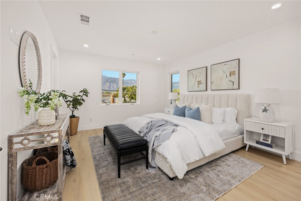 905 Sunset Boulevard, Unit A Arcadia, CA 91007 - Photo 15 of 35 a bedroom with a bed and a potted plant