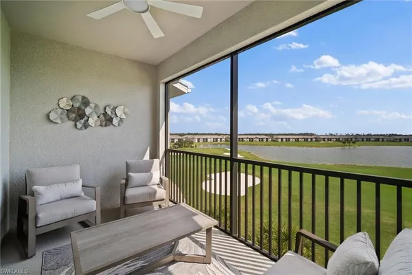 a view of a balcony with furniture