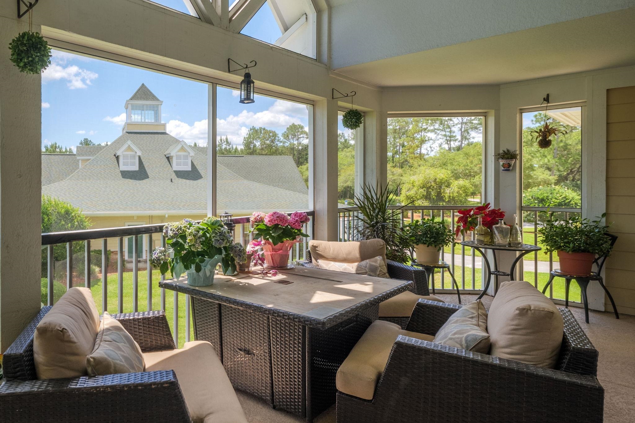 145 North Champions Way, Unit 123 St. Augustine, FL 32092 - Photo 16 of 55 a living room with furniture and a potted plant
