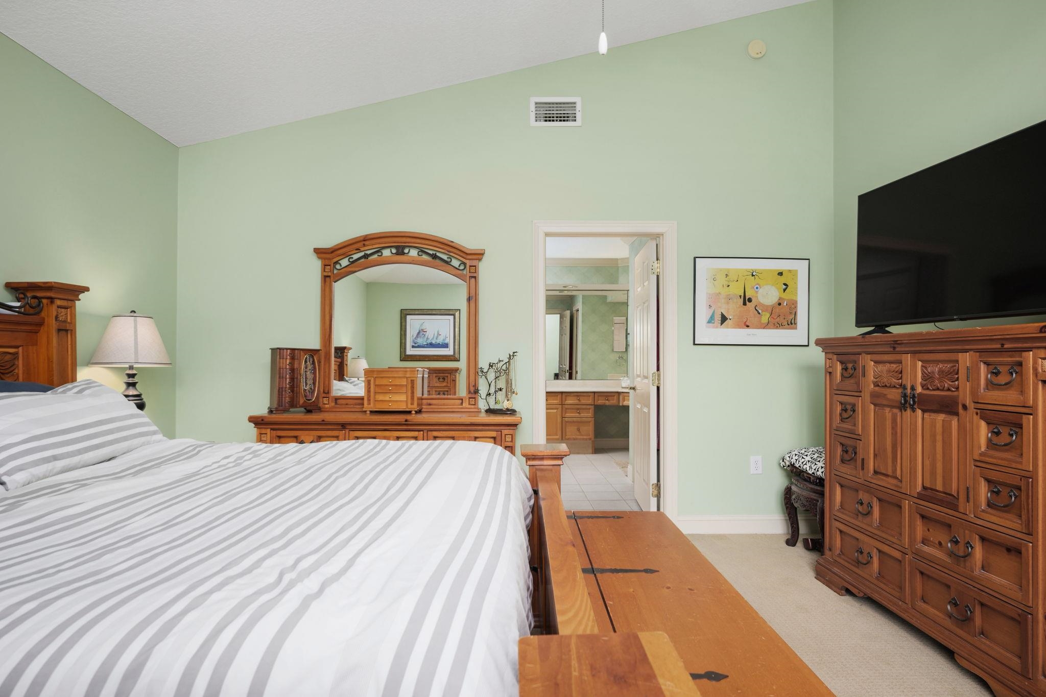 145 North Champions Way, Unit 123 St. Augustine, FL 32092 - Photo 20 of 55 a bedroom with furniture and a flat screen tv