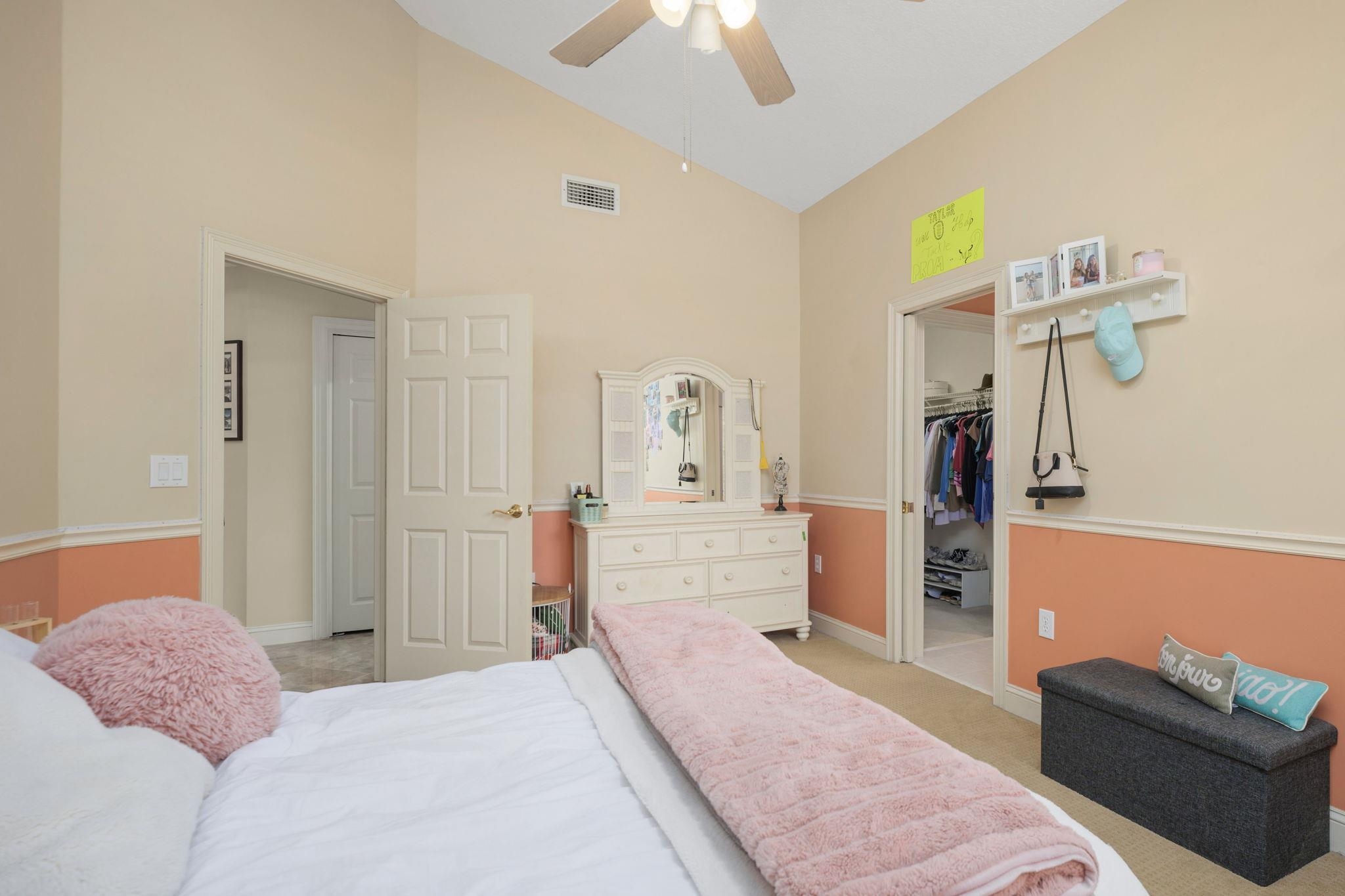 145 North Champions Way, Unit 123 St. Augustine, FL 32092 - Photo 24 of 55 a bedroom with furniture and a mirror