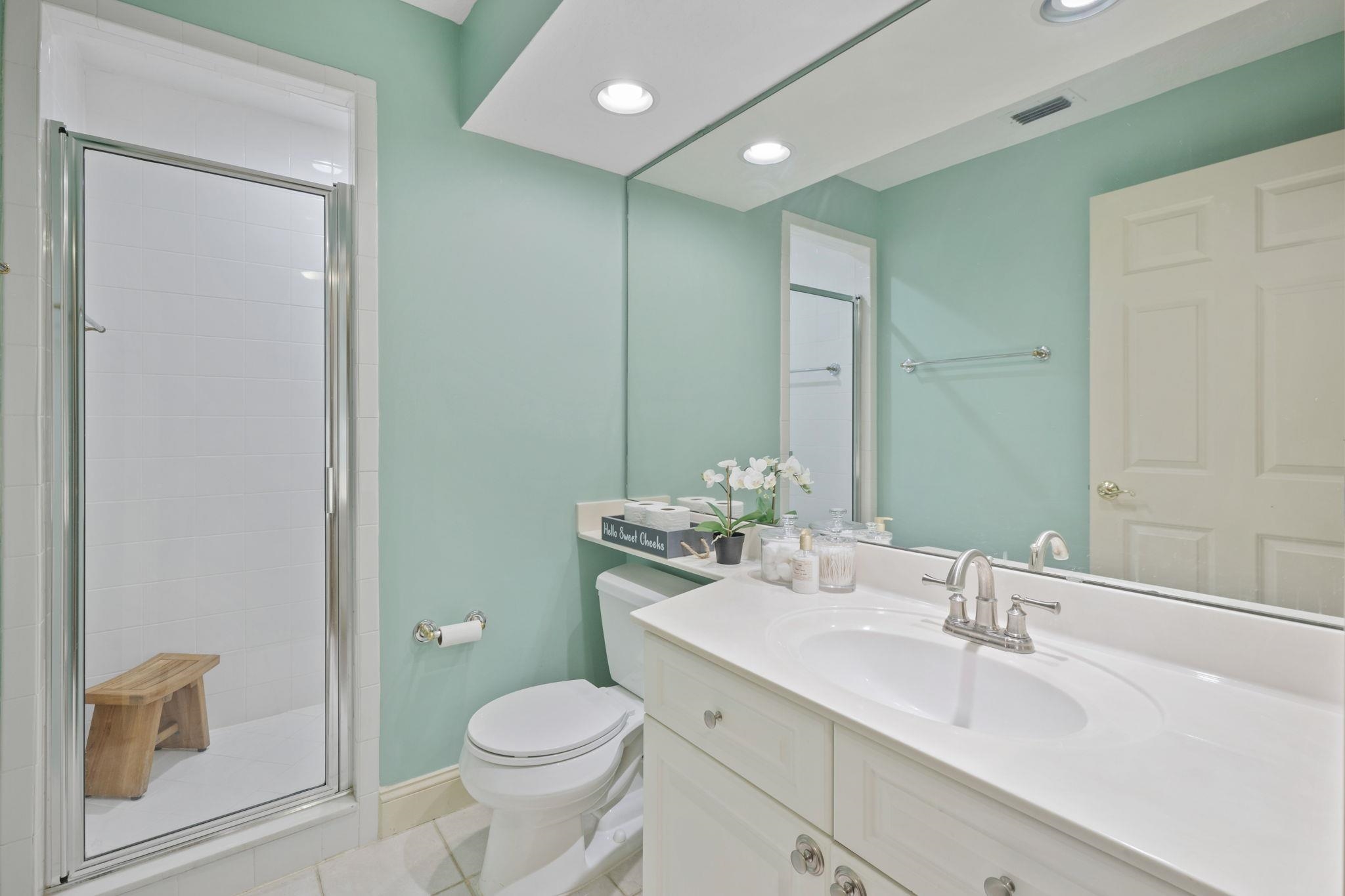 145 North Champions Way, Unit 123 St. Augustine, FL 32092 - Photo 29 of 55 a bathroom with a toilet sink and mirror