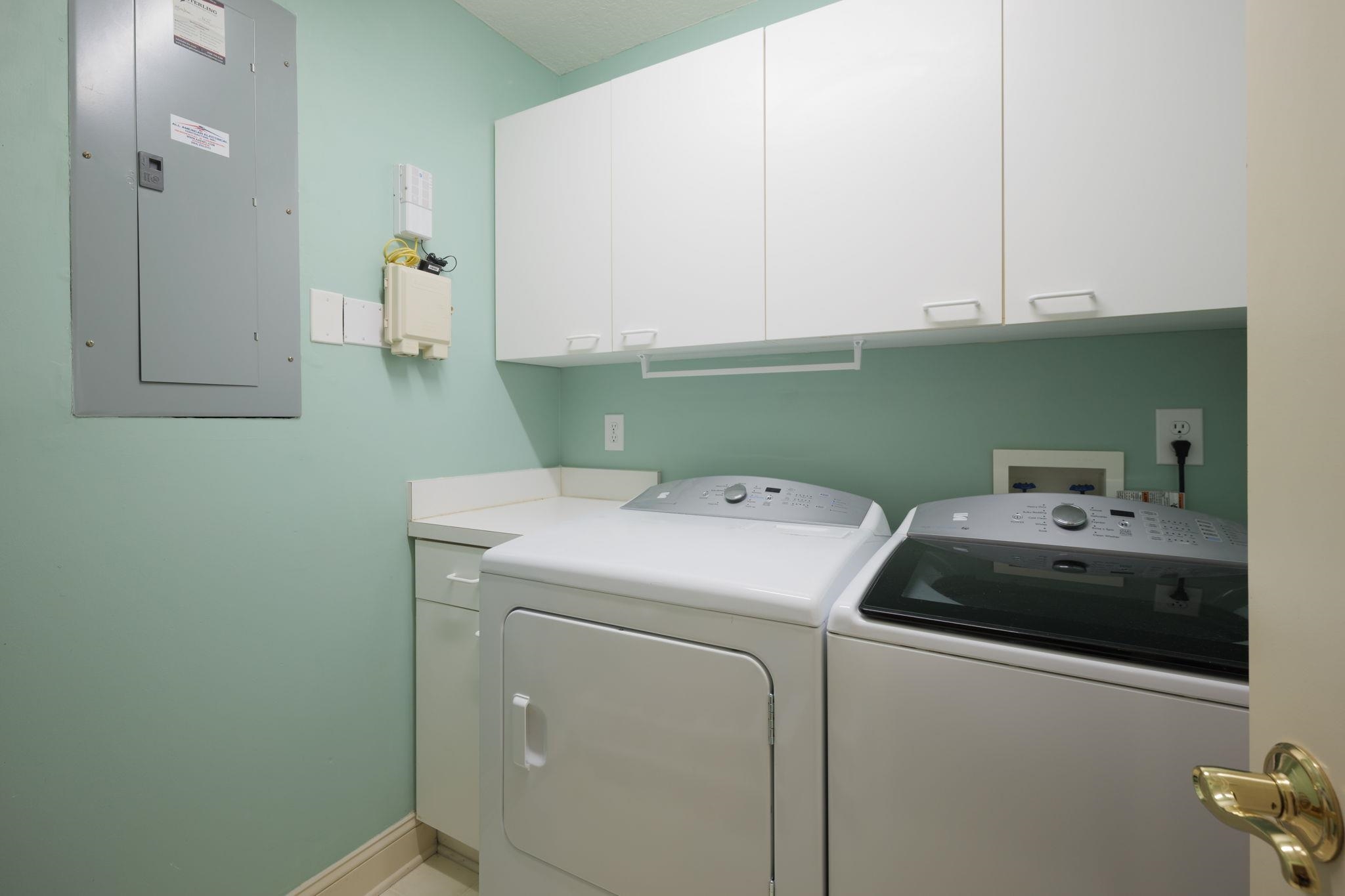 145 North Champions Way, Unit 123 St. Augustine, FL 32092 - Photo 30 of 55 a utility room with dryer and washer