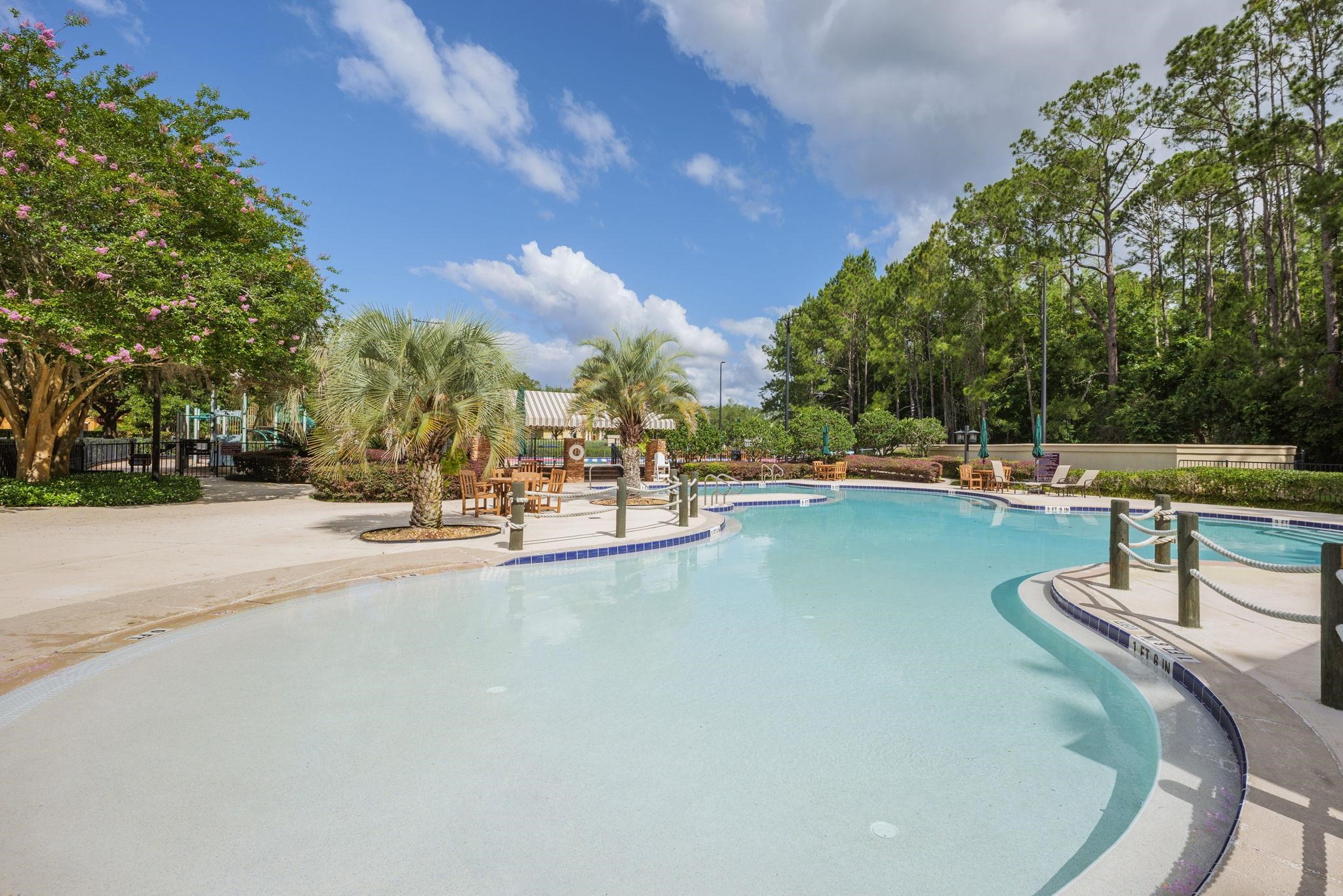 145 North Champions Way, Unit 123 St. Augustine, FL 32092 - Photo 47 of 55 a view of a swimming pool with outdoor seating