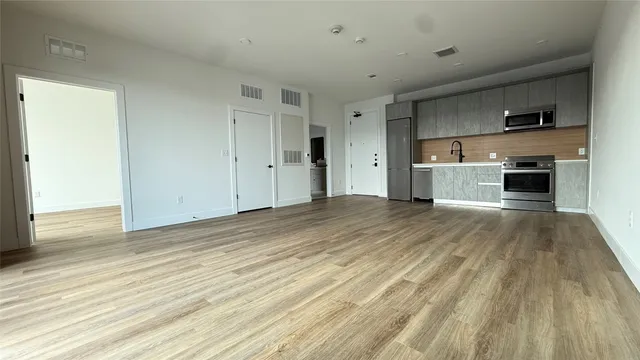 a view of a kitchen from the hallway