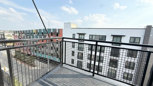 a view of balcony with wooden floor