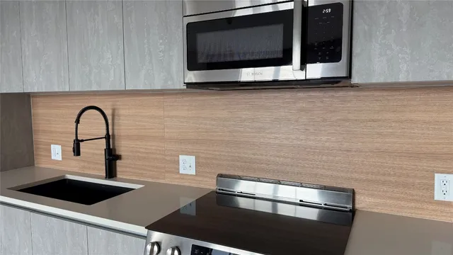 a kitchen with a stove and a microwave