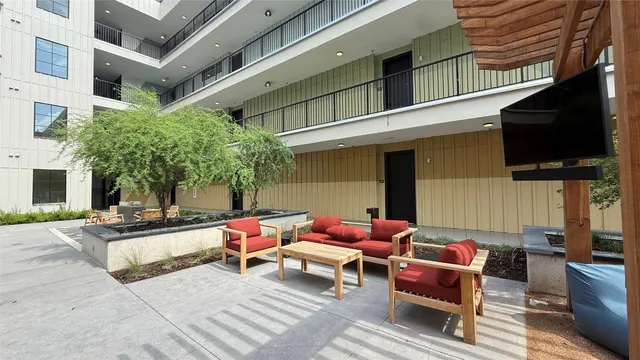 a outdoor space with patio furniture and a fireplace