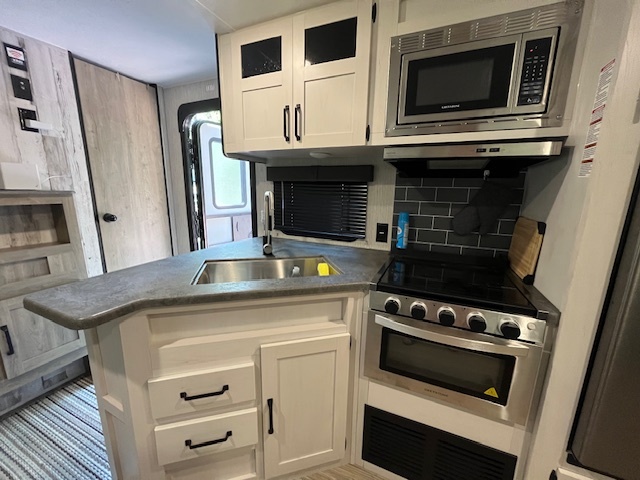 2795 East 28th Road Marseilles, IL 61341 - Photo 12 of 70 a kitchen with a stove and a microwave