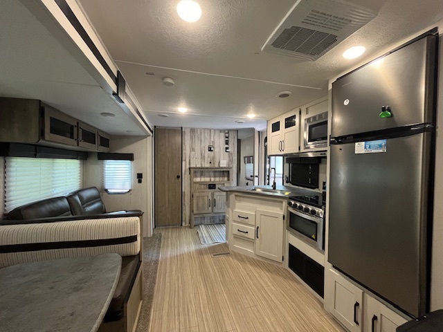2795 East 28th Road Marseilles, IL 61341 - Photo 14 of 70 a kitchen with refrigerator and chairs