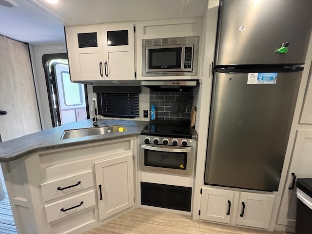 2795 East 28th Road Marseilles, IL 61341 - Photo 15 of 70 a kitchen with a stove and a microwave