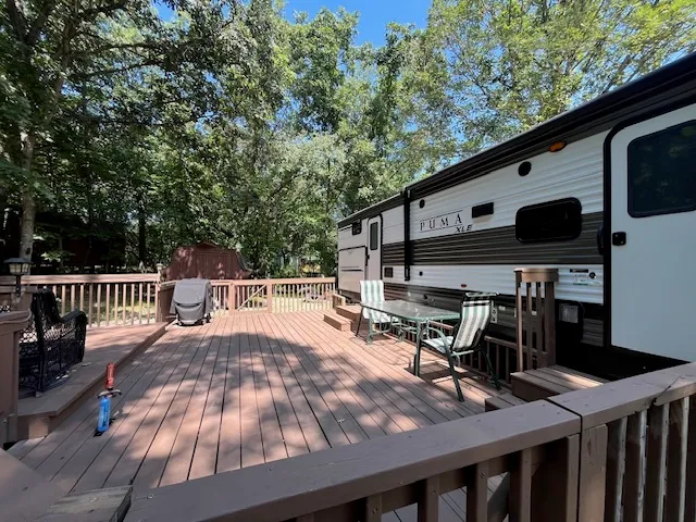 a view of a patio with two chairs and a table