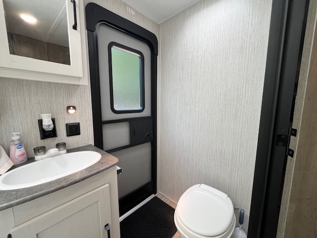 2795 East 28th Road Marseilles, IL 61341 - Photo 31 of 70 a bathroom with a toilet sink and mirror