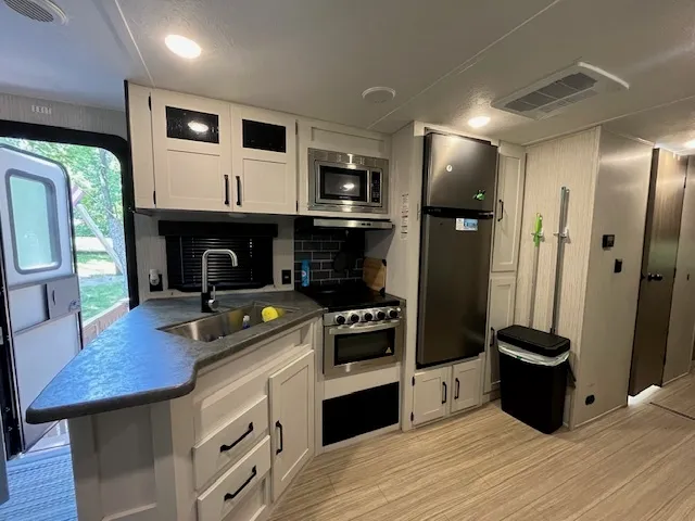 a kitchen with a stove and a microwave