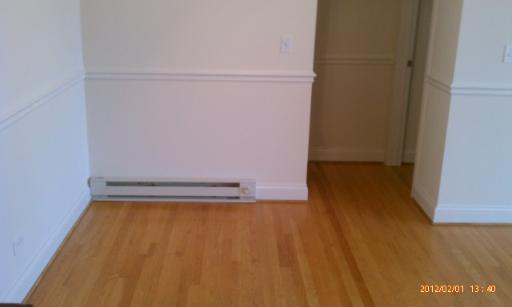 5025 North East River Road, Unit 2B Norridge, IL 60706 - Photo 4 of 9 a view of water heater room with wooden floor