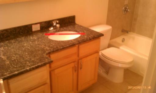 5025 North East River Road, Unit 2B Norridge, IL 60706 - Photo 8 of 9 a bathroom with a toilet and a sink