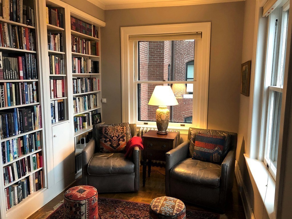 48 Beacon Street, Unit 9R Boston, MA 02108 - Photo 13 of 21 a living room with furniture and a book shelf