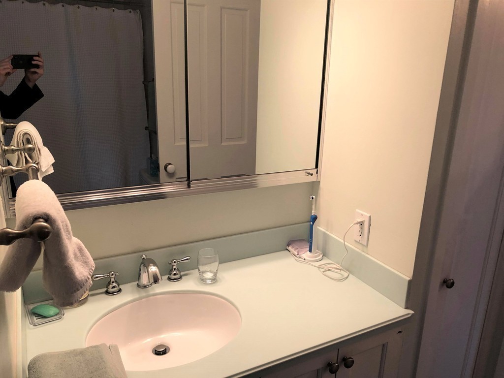 48 Beacon Street, Unit 9R Boston, MA 02108 - Photo 15 of 21 a bathroom with a sink and a mirror