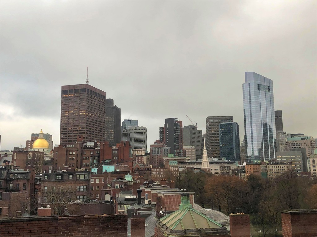 48 Beacon Street, Unit 9R Boston, MA 02108 - Photo 18 of 21 a city view with tall buildings
