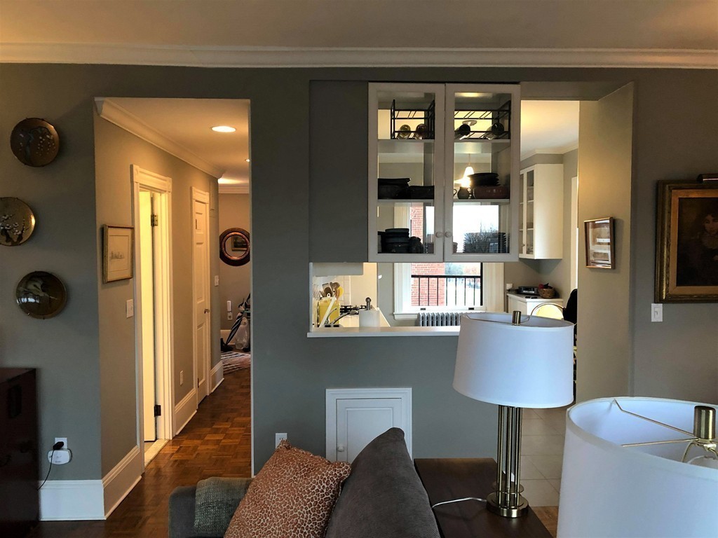 48 Beacon Street, Unit 9R Boston, MA 02108 - Photo 3 of 21 a living room with stainless steel appliances kitchen island furniture and a table