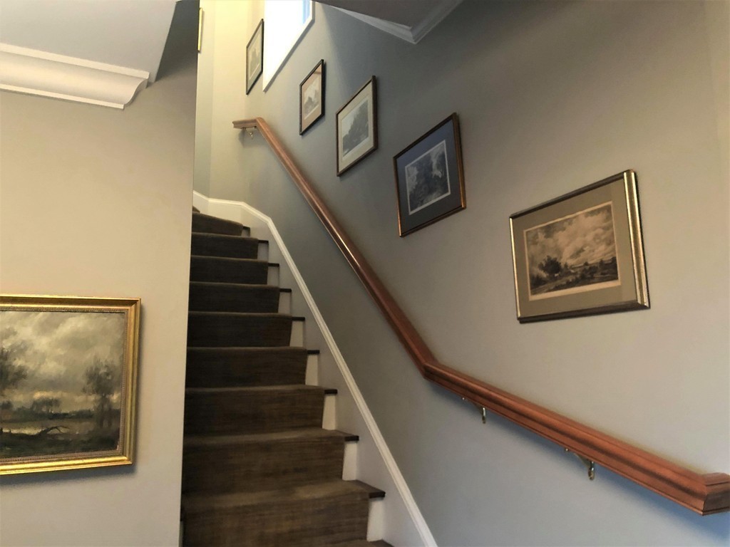 48 Beacon Street, Unit 9R Boston, MA 02108 - Photo 8 of 21 a view of staircase with wooden floor and fan