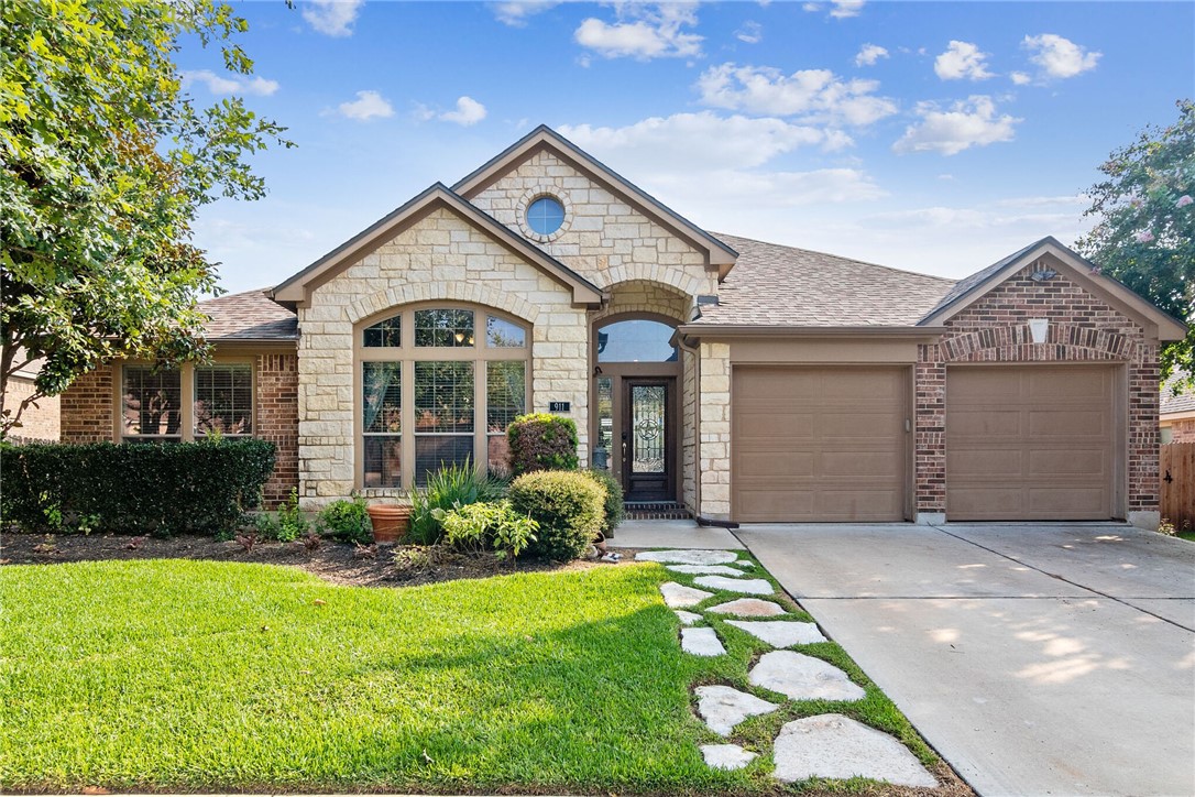 911 Madrone Drive Georgetown, TX 78628 - Photo 1 of 1 a front view of a house with a yard and garage
