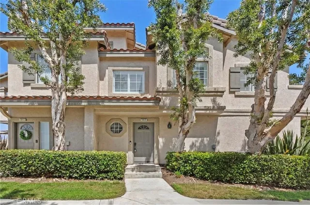 front view of a house with a garden