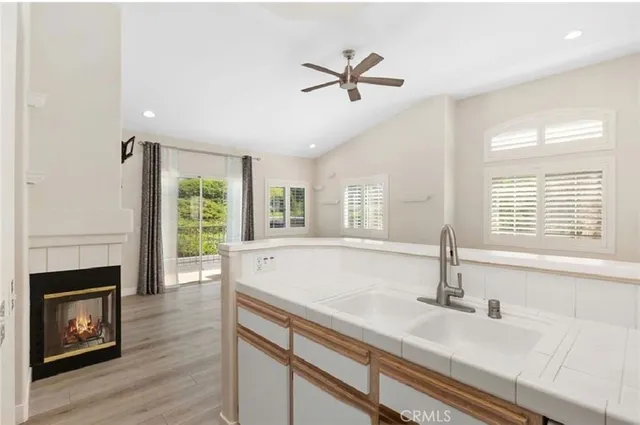 a kitchen with a sink appliances and window