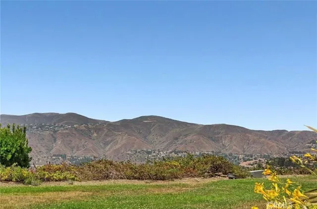 a view of a town with mountains in the background