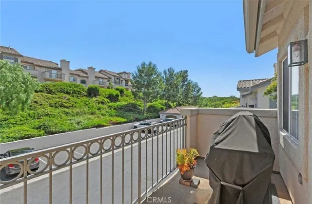 a view of balcony with furniture