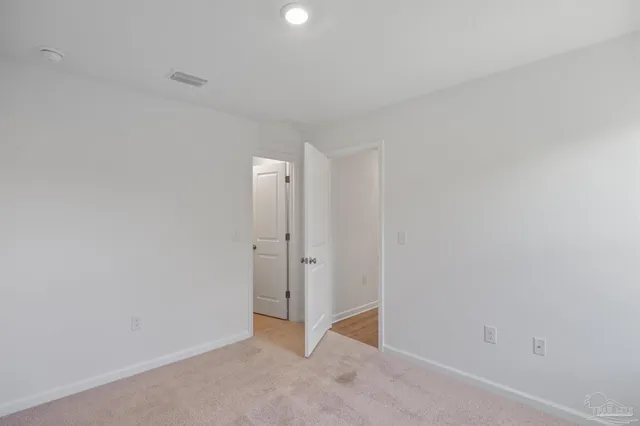 a kitchen with stainless steel appliances and view living room