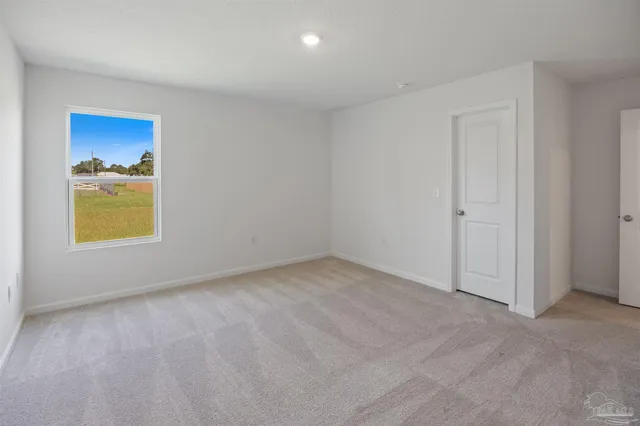 a aerial view of a house with a yard and balcony
