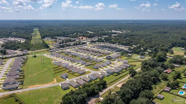 a view of a swimming pool with a yard