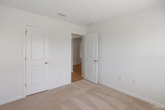a bathroom with a sink toilet and a mirror