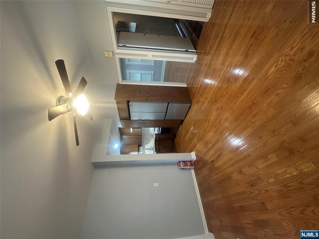 159 Division Avenue, Unit 2 Garfield, NJ 07026 - Photo 3 of 14 a view of a livingroom with a staircase